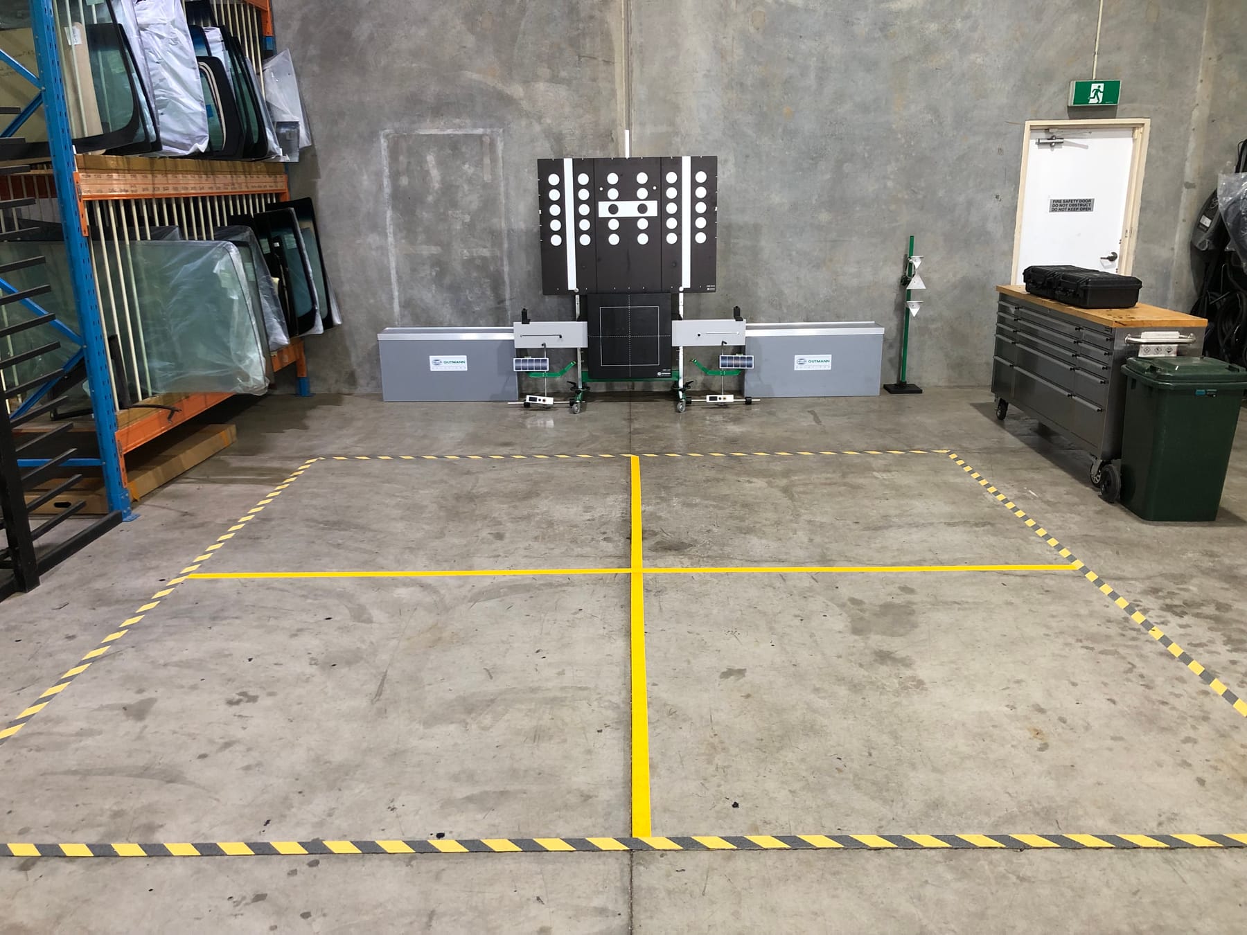 ADAS calibration Morayfield — a Hella Gutmann calibration rig and target board in the Morayfield Auto Glass workshop