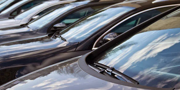 A row of vehicles waiting for windscreen work